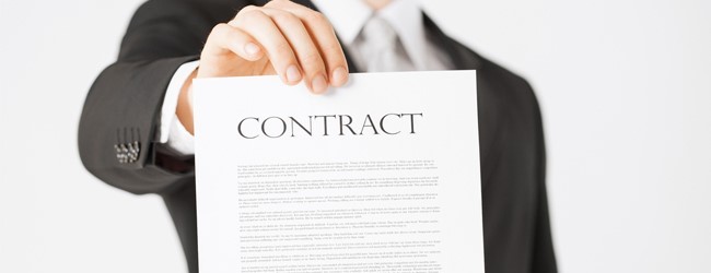 realtor holding a residential lease contract