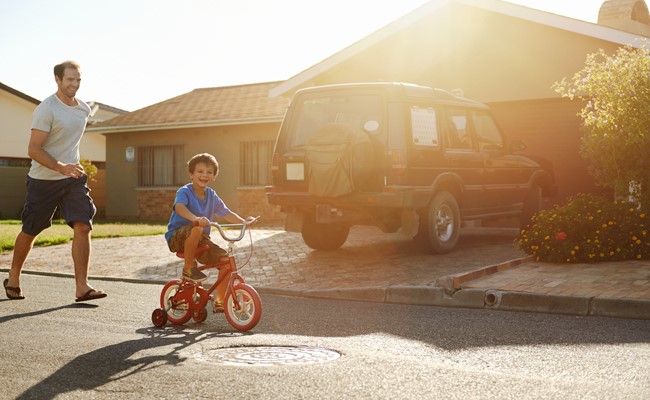 tenant and son playing outside of Houston single family rental house