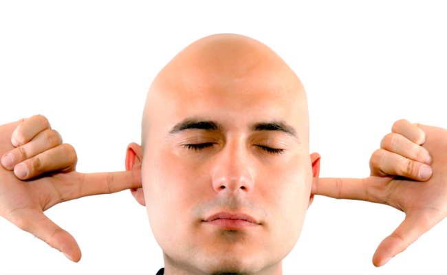 tenant with fingers in his ears