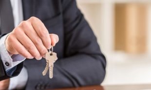 katy tx realtor giving keys to tenant