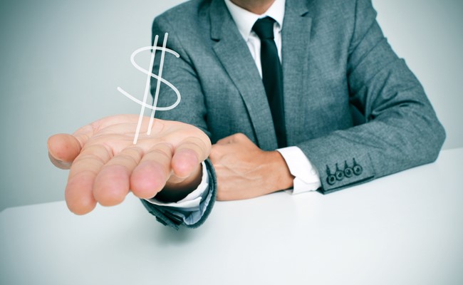 image of man holding dollar symbol