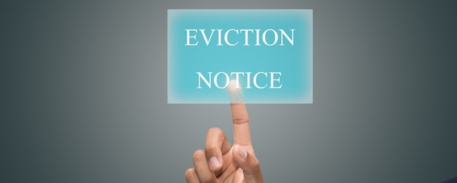 Houston property manager giving a residential tenant an eviction notice