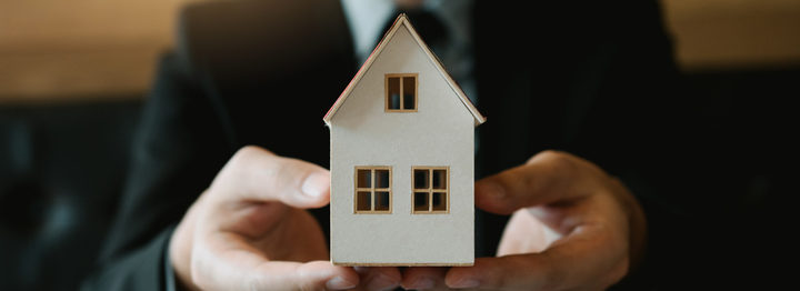 Real estate sales staff give the artificial home to customers.