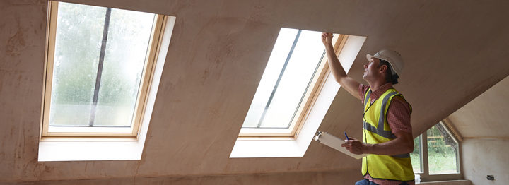 Building Inspector Looking At New Property