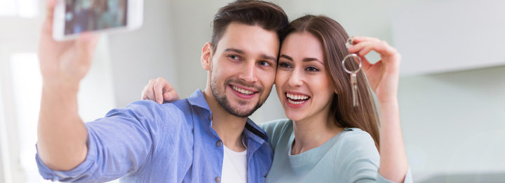 Couple with keys to new home