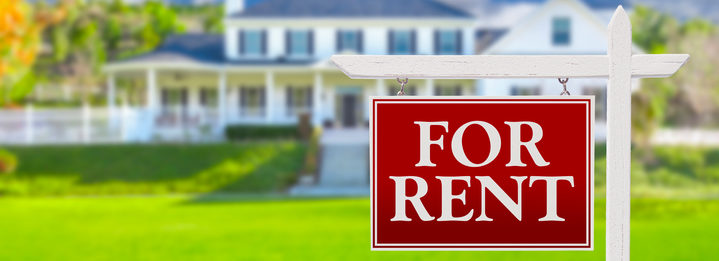 For Rent Real Estate Sign in Front of House