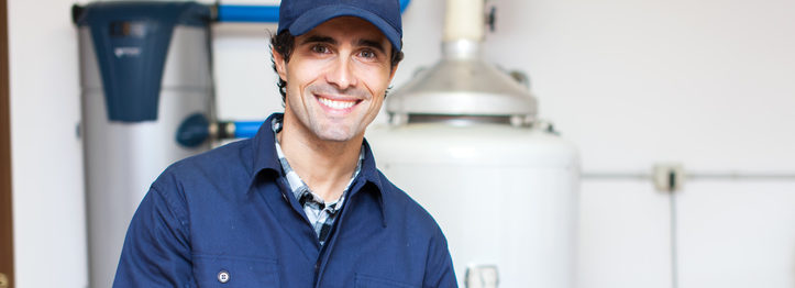 Technician servicing an hot-water heater