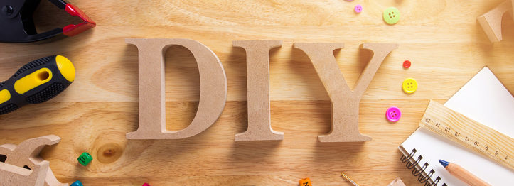 DIY Wood Font Style On a Wooden Workbench Top View.Do it Yourself concept