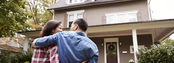 Rear View Of Loving Couple Walking Towards House