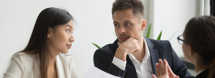 Colleagues discussing job applicant resume