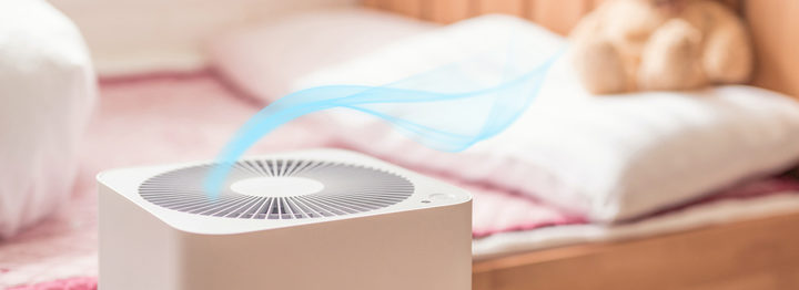 air purifier in bed room. air cleaner removing fine dust in house.