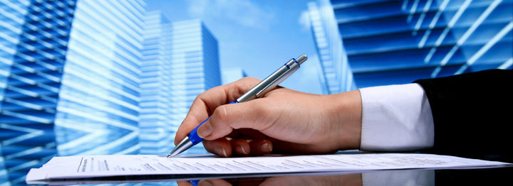 Realtor signing contract on skyscrapers background