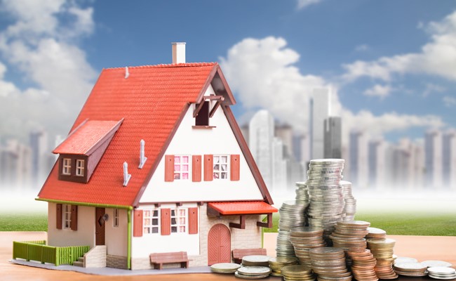 picture of home with money next to it
