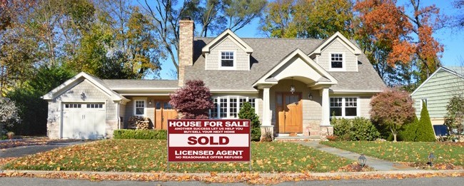 katy texas home with for sale sign in yard