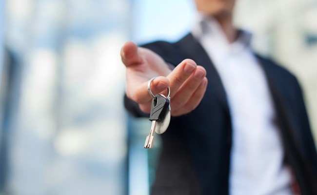 katy texas realtor handing over keys to new home buyer