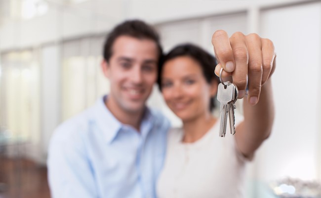 Couple purchase new home and receive keys from katy texas realtor