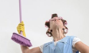 tenant poking ceiling of rental home with broom